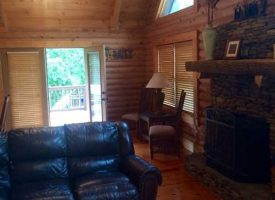 Come to the country on this 100 acres with beautiful log home